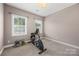 Spare bedroom with two windows and a recumbent exercise bike at 362 Windell Dr # 67, Fort Mill, SC 29708