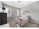 Bright bedroom with two large windows, and pink decorative pieces at 362 Windell Dr # 67, Fort Mill, SC 29708