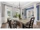Elegant dining room with modern lighting, wood flooring, and large windows providing plenty of natural light at 362 Windell Dr # 67, Fort Mill, SC 29708