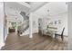 Welcoming entryway features wood flooring, a staircase, and elegant light fixtures. Dinning area is also pictured at 362 Windell Dr # 67, Fort Mill, SC 29708