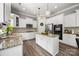 Bright kitchen boasts white cabinets, granite countertops, stainless steel appliances, and an island at 362 Windell Dr # 67, Fort Mill, SC 29708