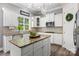 Sunlit kitchen showcases white cabinets, granite countertops, and an island at 362 Windell Dr # 67, Fort Mill, SC 29708