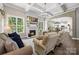 Inviting living room with coffered ceiling, a cozy fireplace, large windows, and an open concept at 362 Windell Dr # 67, Fort Mill, SC 29708