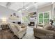 Bright living room featuring a fireplace, coffered ceiling, with windows that provide lots of natural light at 362 Windell Dr # 67, Fort Mill, SC 29708
