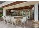 Outdoor kitchen features granite countertop bar with stainless steel grill and TV at 362 Windell Dr # 67, Fort Mill, SC 29708