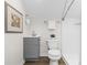 Neutral bathroom with a modern vanity, toilet, and shower with subway tile at 3726 The Plaza None, Charlotte, NC 28205