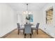 Elegant dining room with modern light fixture, round glass table, and stylish decor at 3726 The Plaza None, Charlotte, NC 28205