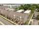 An aerial view of newly constructed townhouses surrounded by lush green trees at 3737 S Tryon St, Charlotte, NC 28217