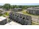 Aerial view of modern townhouses with dark grey siding and a black roof at 3737 S Tryon St, Charlotte, NC 28217
