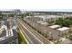 A high angle aerial view of townhouses in an urban environment with city skyline in the background at 3737 S Tryon St, Charlotte, NC 28217