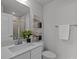 Bathroom featuring a vanity with drawers, a mirror, and a glass-enclosed shower at 3737 S Tryon St, Charlotte, NC 28217