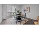 Stylish dining area with sliding glass door, a round table, and modern decor at 3737 S Tryon St, Charlotte, NC 28217