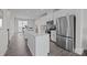 Bright kitchen boasts white cabinetry, stainless steel appliances, and a convenient center island at 3737 S Tryon St, Charlotte, NC 28217