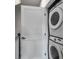 Convenient laundry room featuring a stacked washer and dryer at 3737 S Tryon St, Charlotte, NC 28217