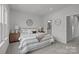 Comfortable main bedroom complete with calm decor, soft bedding, and ample natural light at 3737 S Tryon St, Charlotte, NC 28217