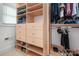 Custom closet features built-in shelves and hanging rods for clothing and shoes at 4044 Somerdale Ln, Charlotte, NC 28205