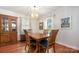 Elegant dining room with hardwood floors, classic furniture, and a stylish chandelier at 4044 Somerdale Ln, Charlotte, NC 28205