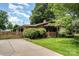 Charming brick home with well-manicured lawn and mature landscaping at 4044 Somerdale Ln, Charlotte, NC 28205