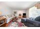 Cozy living room featuring hardwood floors, neutral tones, and abundant natural light at 4044 Somerdale Ln, Charlotte, NC 28205