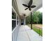 Enjoy the covered porch with ceiling fans and dark metal railings, perfect for relaxing outdoors at 4435 Cornett Dr # 30, Iron Station, NC 28080