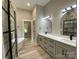 Modern bathroom with double vanity, soaking tub, separate shower, and neutral color palette at 4435 Cornett Dr # 30, Iron Station, NC 28080