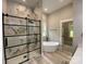 Spa-like bathroom with marble shower, soaking tub, and black fixtures; a serene retreat at 4435 Cornett Dr # 30, Iron Station, NC 28080