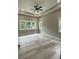 Spacious bedroom with tray ceiling, fan, recessed lighting, and lots of windows providing natural light at 4435 Cornett Dr # 30, Iron Station, NC 28080