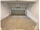 An empty and spacious two car garage with concrete flooring at 4435 Cornett Dr # 30, Iron Station, NC 28080