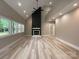 Spacious living room with a striking fireplace, recessed lighting, and light wood floors at 4435 Cornett Dr # 30, Iron Station, NC 28080