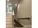 Stairwell features hardwood steps and railing leading to second story at 4435 Cornett Dr # 30, Iron Station, NC 28080