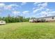 Expansive backyard view of the home with a deck, shed, and wooded area providing ample space at 4518 Logging Rd, Lancaster, SC 29720