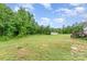 Large backyard featuring a shed and wooded area; plenty of space for outdoor enjoyment at 4518 Logging Rd, Lancaster, SC 29720
