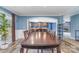 Open-concept dining area featuring a wooden table, stylish decor, and kitchen views through an archway at 4518 Logging Rd, Lancaster, SC 29720
