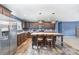 Spacious kitchen with a center island, stainless steel appliances, and wood-look flooring at 4518 Logging Rd, Lancaster, SC 29720