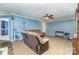 Inviting living room with a cozy sectional sofa, blue walls, and decorative shelving unit near doorway at 4518 Logging Rd, Lancaster, SC 29720