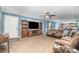 Comfortable living room features a large TV on a rustic entertainment center and cozy sectional sofa at 4518 Logging Rd, Lancaster, SC 29720