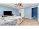 Bright main bedroom with a ceiling fan, neutral carpet, and an en-suite bathroom at 4518 Logging Rd, Lancaster, SC 29720