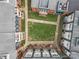 Aerial view of a courtyard surrounded by apartments with a central grassy area and walkway at 482 New Bern Station Ct, Charlotte, NC 28209