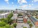 Aerial view showcases the community, nearby buildings, and downtown skyline at 482 New Bern Station Ct, Charlotte, NC 28209