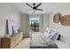 Bright bedroom features a ceiling fan, natural light, and a spacious layout at 482 New Bern Station Ct, Charlotte, NC 28209