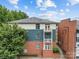 Exterior view showcasing balconies and the blend of brick and siding at 482 New Bern Station Ct, Charlotte, NC 28209