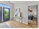 Hallway with art display leads to the bedroom with a balcony view at 482 New Bern Station Ct, Charlotte, NC 28209