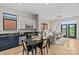 Contemporary open floor plan boasts sleek cabinetry, stainless appliances, and bright living area at 482 New Bern Station Ct, Charlotte, NC 28209