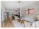 Open-concept living area with modern lighting and comfortable furnishings at 482 New Bern Station Ct, Charlotte, NC 28209