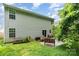 Backyard view with patio, greenery, and house siding at 4837 Autumn Oak Dr, Charlotte, NC 28269