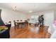 Spacious dining room with hardwood floors and a modern light fixture. Plenty of room for entertaining guests at 4837 Autumn Oak Dr, Charlotte, NC 28269