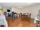 Spacious dining room with hardwood floors and modern chandelier, perfect for Gathering gatherings at 4837 Autumn Oak Dr, Charlotte, NC 28269