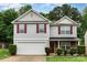 Charming two-story home with red shutters, stone accents and a two car garage in a well-maintained yard at 4837 Autumn Oak Dr, Charlotte, NC 28269