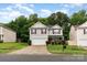 Charming two-story home with red shutters, stone accents and a two car garage on a well-manicured lot at 4837 Autumn Oak Dr, Charlotte, NC 28269