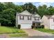 Charming two-story home with red shutters, stone accents and a two car garage in a well-maintained yard at 4837 Autumn Oak Dr, Charlotte, NC 28269